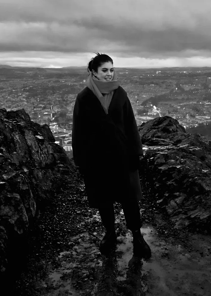 Olivia standing on Arthur’s Seat in Edinburgh